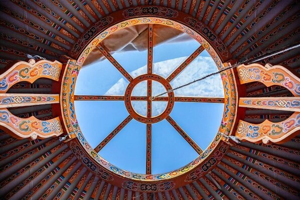 A circular architectural design with a central window and intricate patterns. - 28 Palms Ranch (Twentynine Palms)