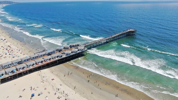 A pier extending into the ocean with beach houses and a sandy beach. - 1 Block to Beach/Restaurants/Bars, Remodeled, 2-Car Garage w/fee, Yard, Sleep 10 (San Diego)