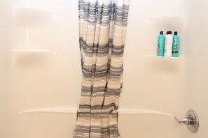Combined shower/tub, hair dryer, towels, soap