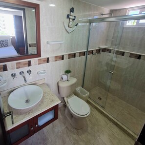 Shower, towels, soap, toilet paper