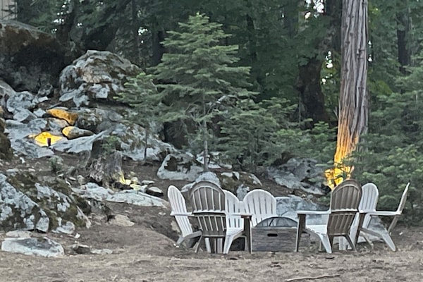 Gather around the wood firepit out back surrounded by mountain beauty