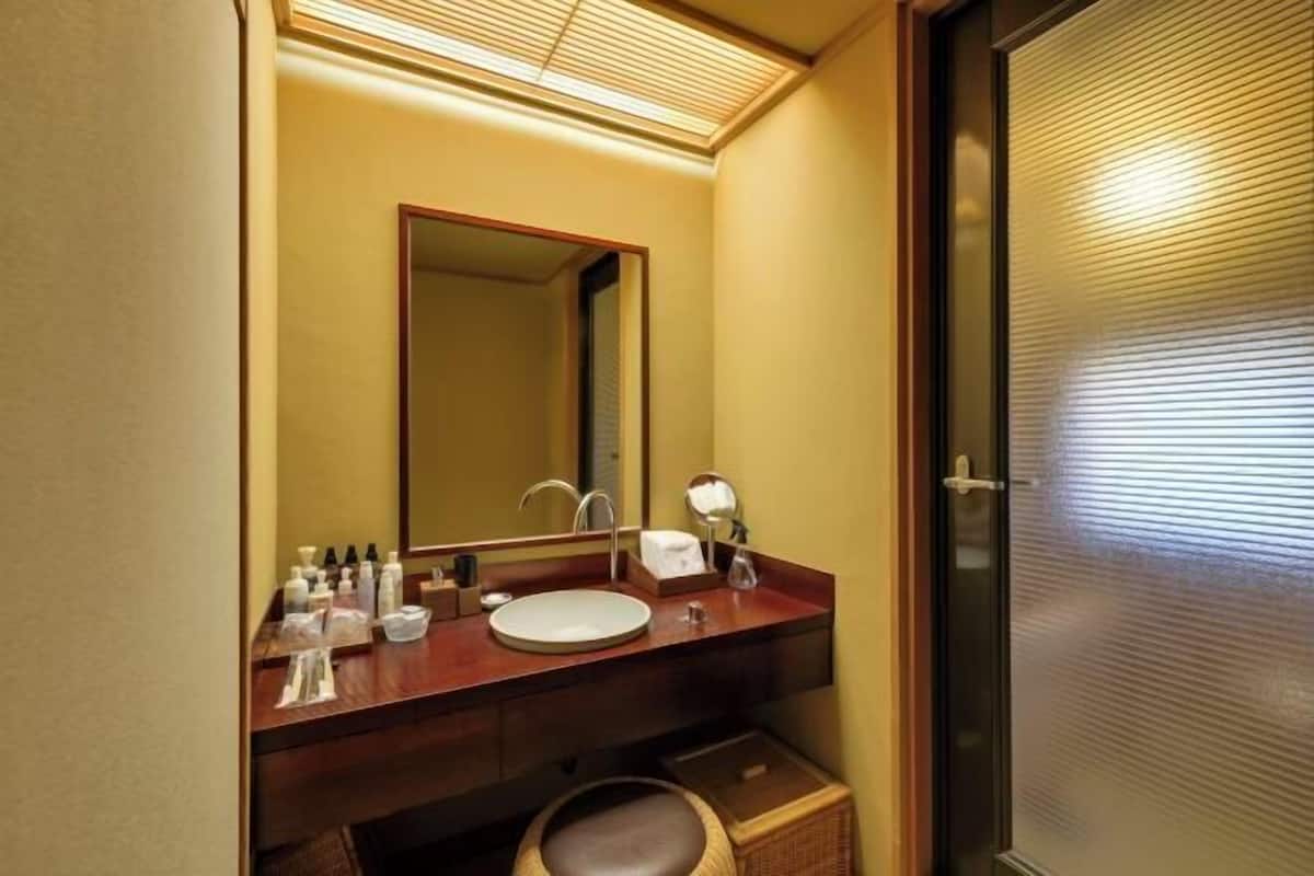 Bathroom | Combined shower/tub, spring water tub, hair dryer, slippers