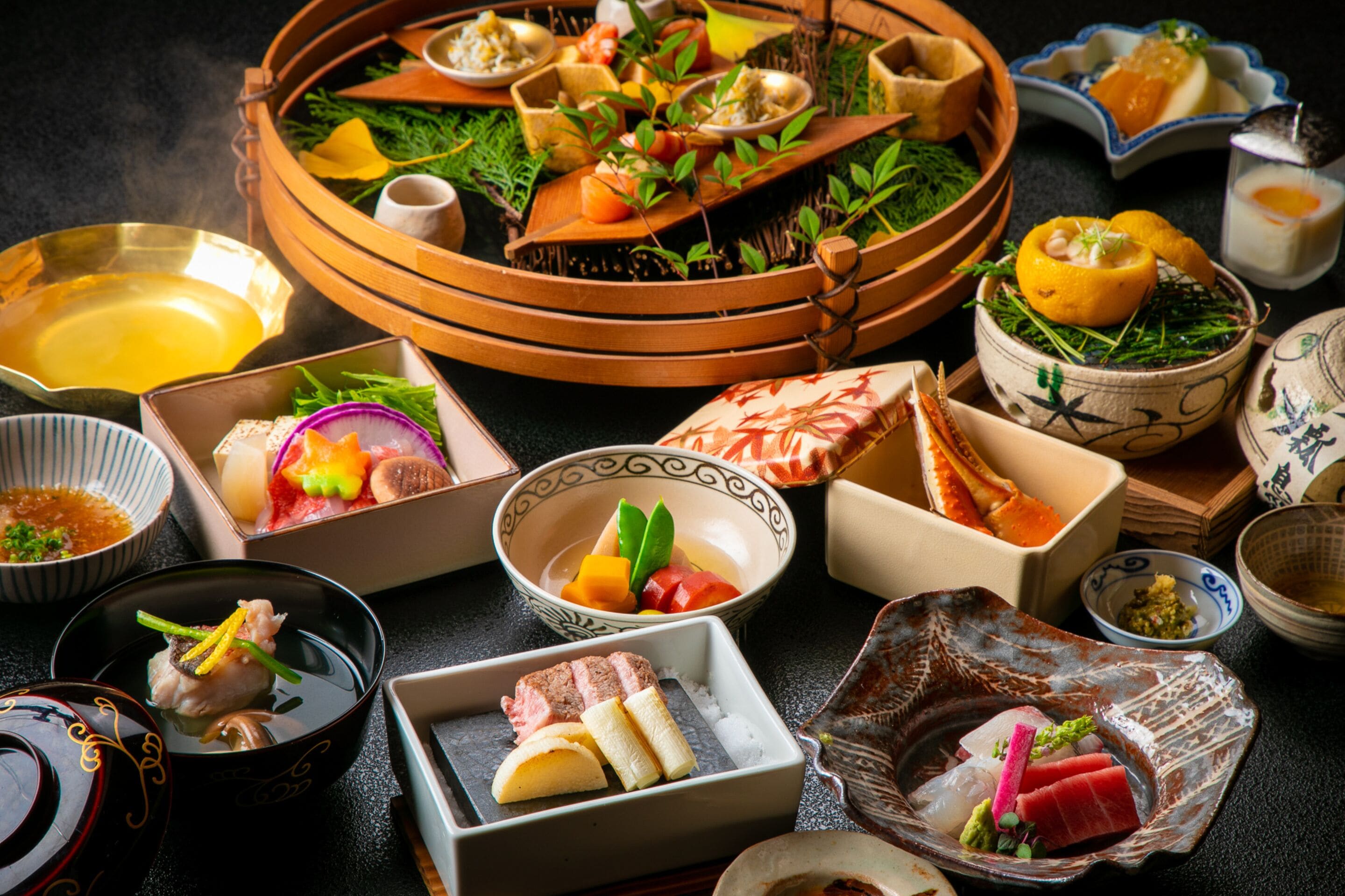 A variety of traditional Japanese dishes arranged on a table.