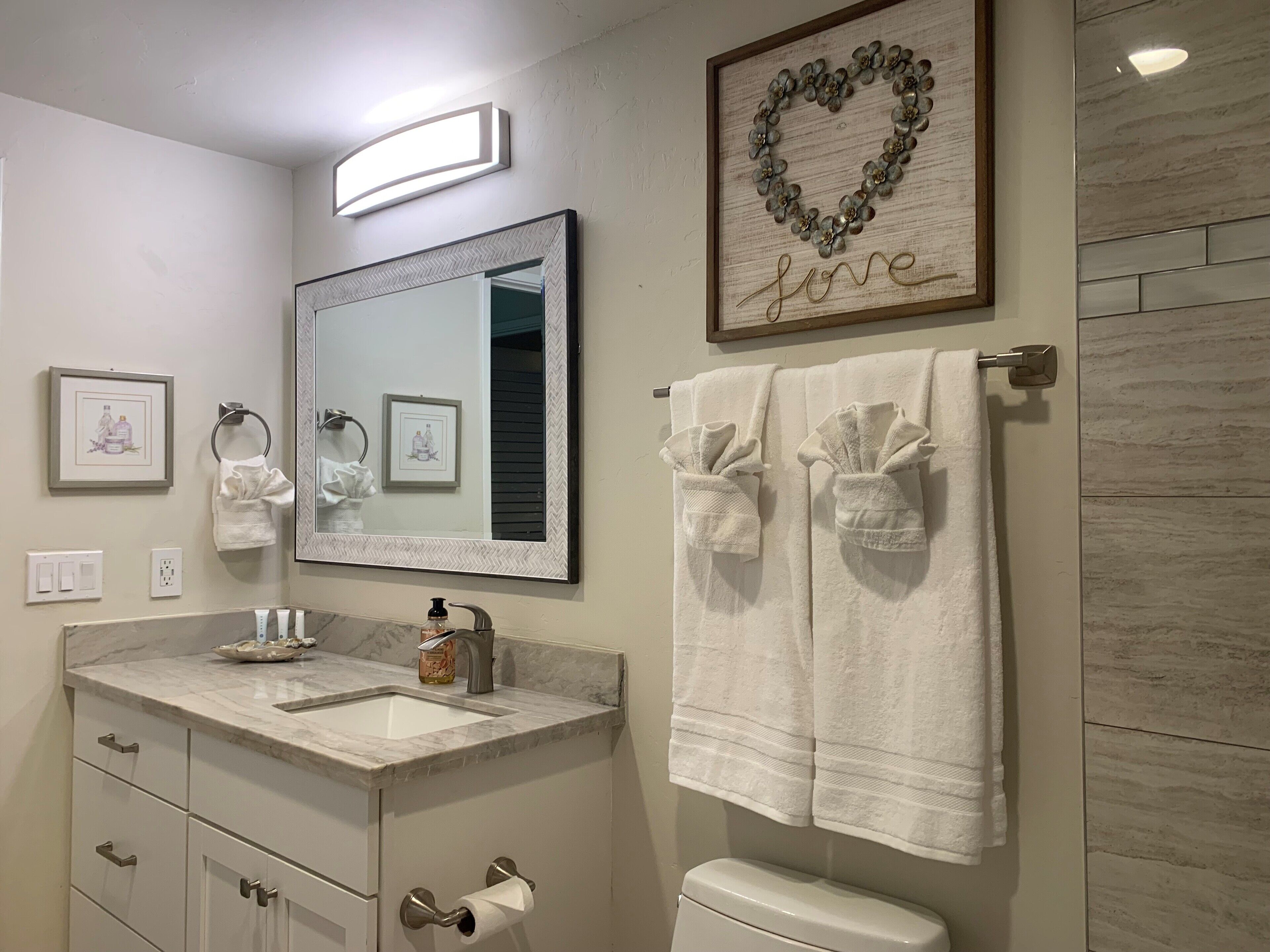 Combined shower/tub, hair dryer, towels, toilet paper