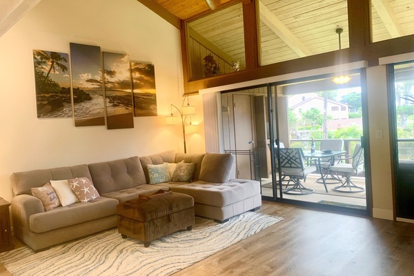 Large open living area with 18' ceilings and plenty of light.