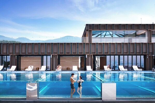 Outdoor pool, open 9:00 AM to 8:00 PM, pool loungers