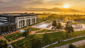 A modern building with a courtyard, outdoor seating, and a pool. - Kings Valley Medical & Spa Hotel (Kazanlak)