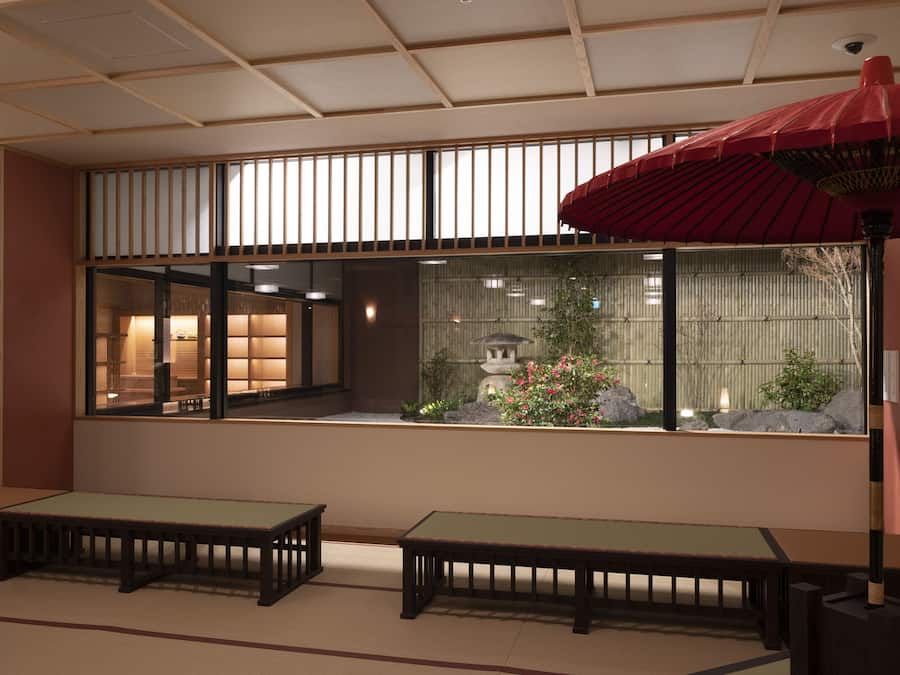 A traditional Japanese room with tatami flooring, a low table, a bench, and a large window overlooking a garden with a stone lantern and a pagoda.