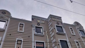 A hotel facade with the name "The Republic" and a crown logo. - The Republic Hotel (Ambala)