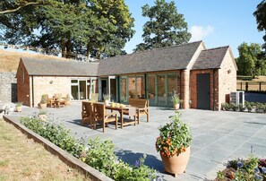 Outdoor dining - A beautifully converted traditional farm building within a secluded woodland. (Burton on Trent)