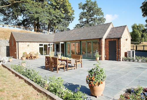 A beautifully converted traditional farm building within a secluded woodland.