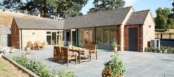 A beautifully converted traditional farm building within a secluded woodland.