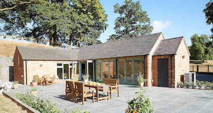 A beautifully converted traditional farm building within a secluded woodland.