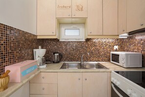 Casa, 1 quarto, para fumantes, varanda | Cozinha privada