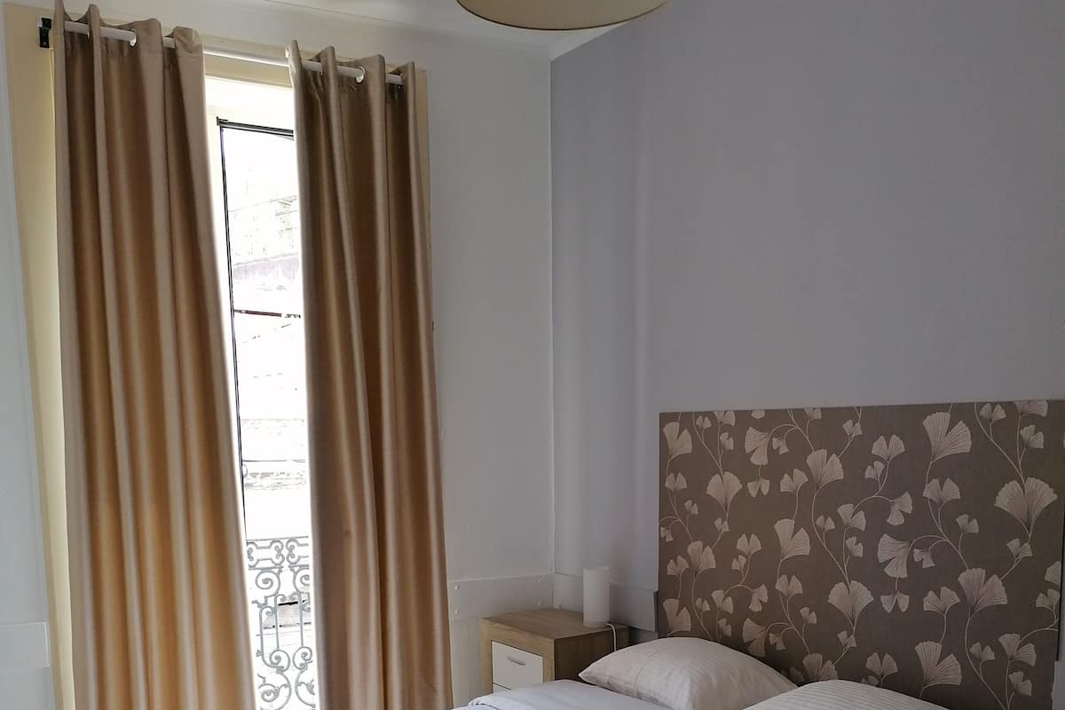 Premium bedding, down duvets, blackout curtains, free WiFi