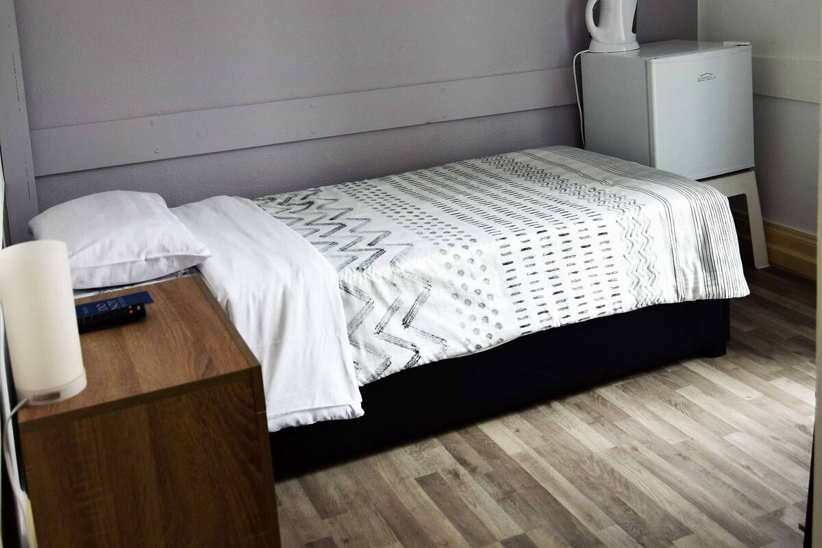 Premium bedding, down duvets, blackout curtains, free WiFi
