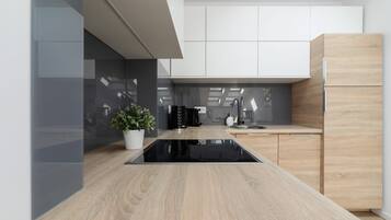 Fridge, stovetop, dishwasher, coffee/tea maker