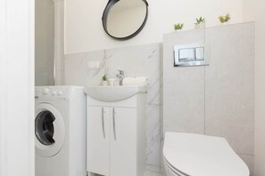 Bathtub, hair dryer, shampoo