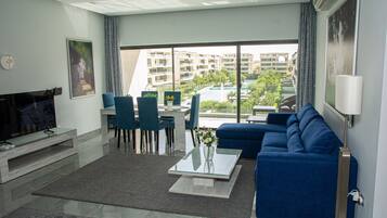 Comfort Apartment | Living area | 50-inch Smart TV with satellite channels, TV