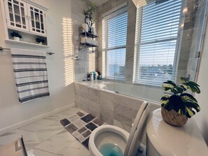 Combined shower/bathtub, hair dryer, towels, soap - Sun Drenched Penthouse with Million Dollar View (Weehawken)