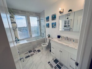 Combined shower/tub, hair dryer, towels, soap