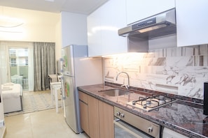 Apartamento standard | Cozinha privada | Geladeira grande, micro-ondas, torradeira