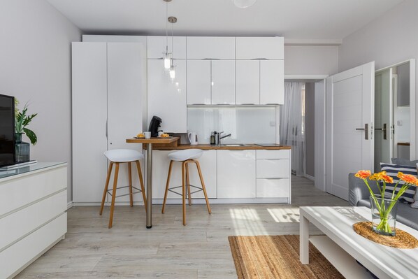 Dishwasher, coffee/tea maker, highchair, cookware/dishes/utensils