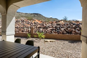 Relax in a scenic outdoor space with a view of the surrounding rocky landscape.