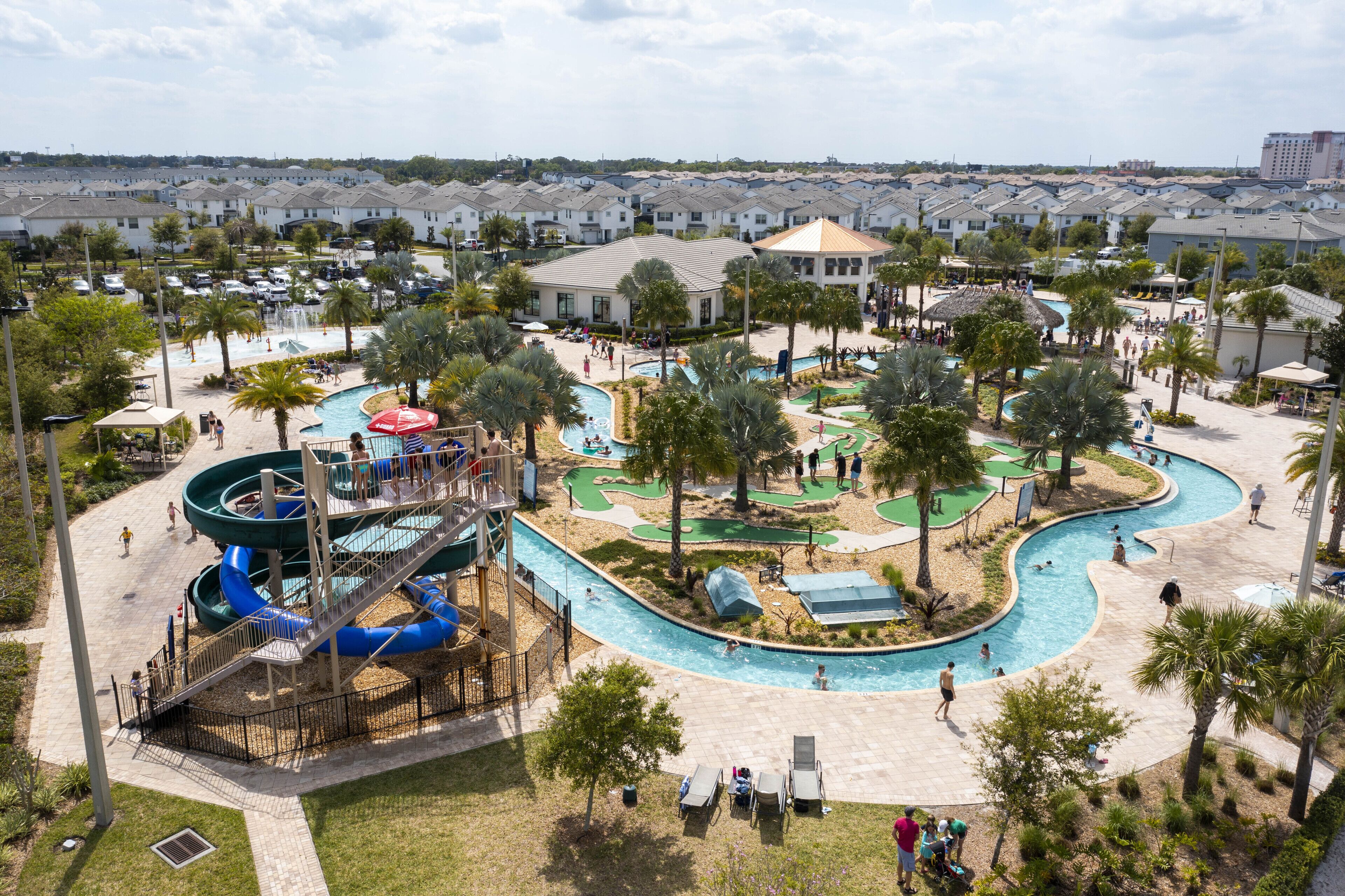 A water park with multiple pools, slides, and a golf course.