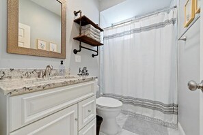 Combined shower/bathtub, hair dryer, towels, soap