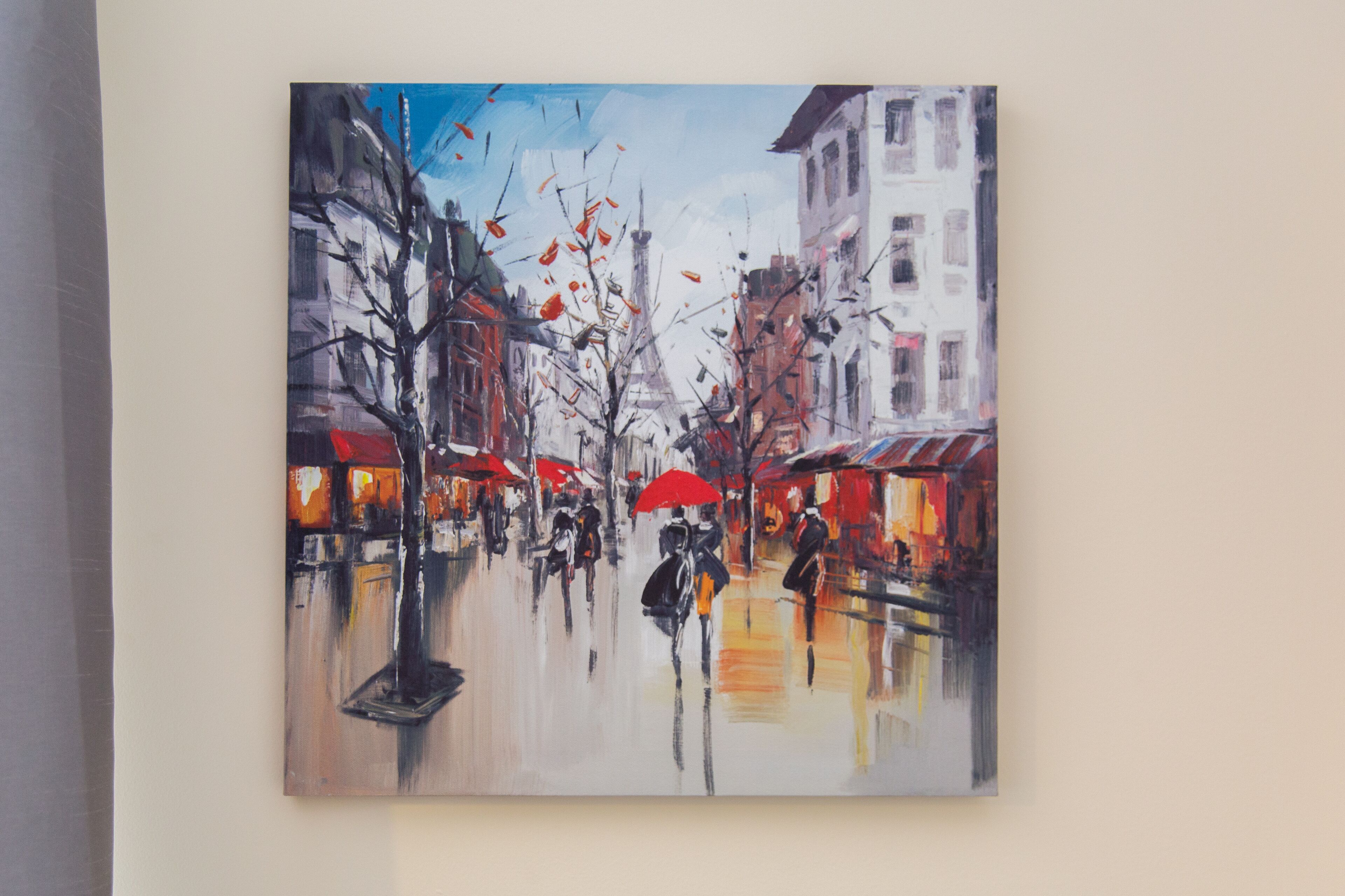 A painting of a rainy street scene with buildings and people.