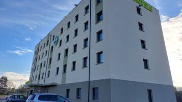 A B&B hotel building with a modern design, featuring multiple windows and a prominent B&B logo.
