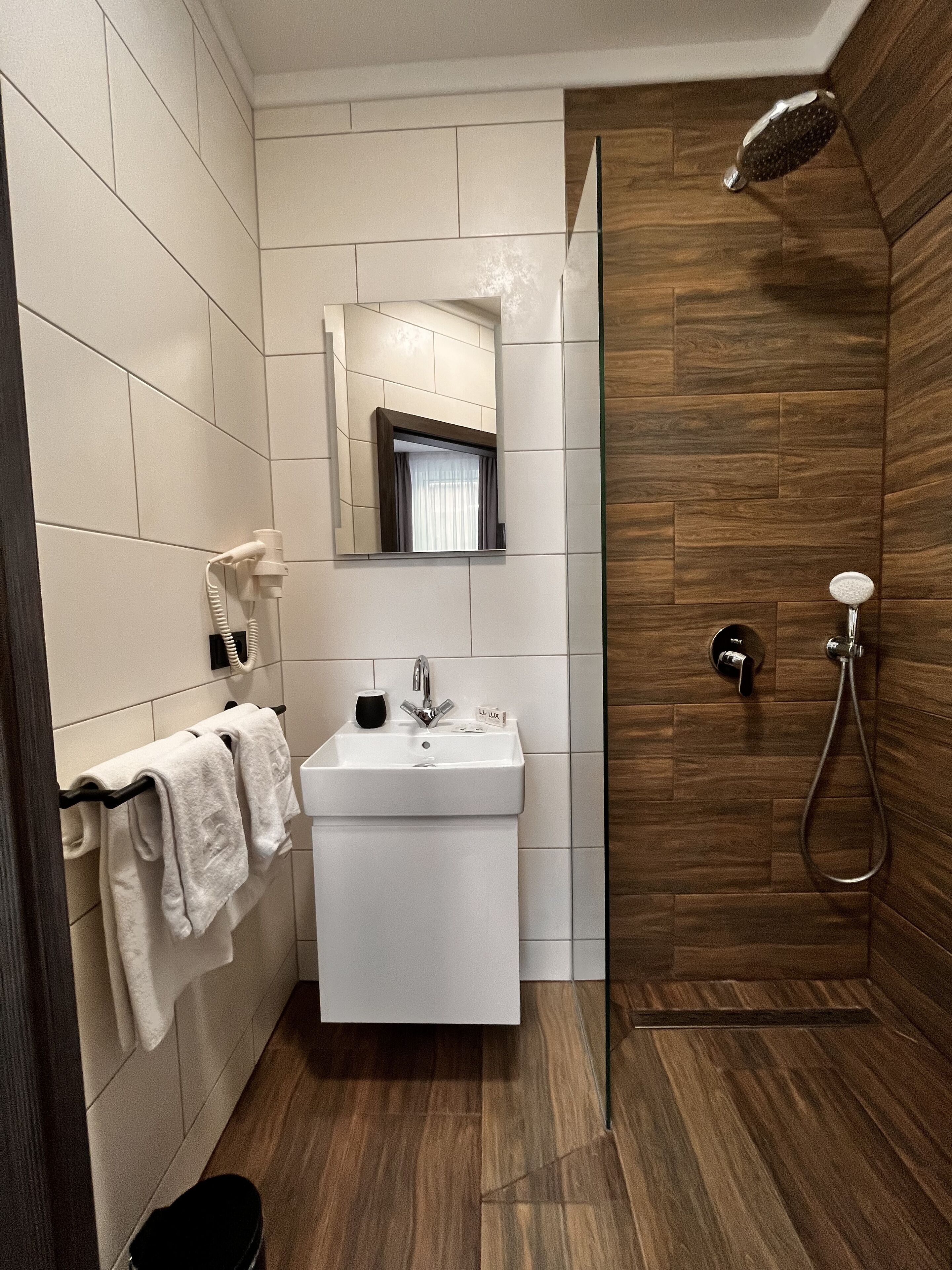 superior quadruple room | bathroom | hair dryer, slippers, heated floors, towels