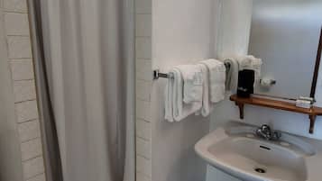 Shower, towels, soap, toilet paper