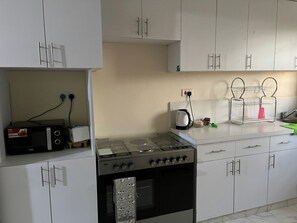 Apartment | Private kitchen | Fridge, microwave, oven, stovetop