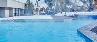 Ski-in/out condo with mountain views, pool, hot tub, sauna, gym & fireplace