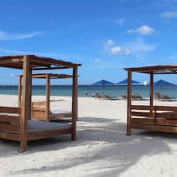 Beach nearby, white sand, beach towels