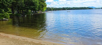 Dog-friendly waterfront cottage with private dock, community beach, grill, W/D