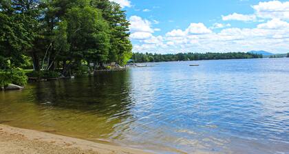 Dog-friendly waterfront cottage with private dock, community beach, grill, W/D