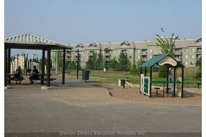 Residents can enjoy a central courtyard with a seating area and playground.