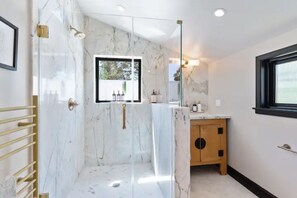 Shower, hair dryer, heated floors, towels