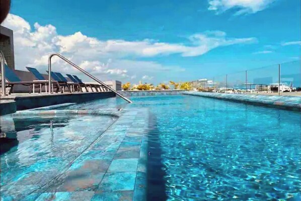 Outdoor pool - Deluxe Studio Suite in new Celebrity designed  Building, 2 blocks from beach. (Playa del Carmen)