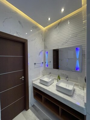 Shower, hair dryer, towels, soap
