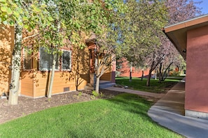 Stroll up to this charming home with a beautifully manicured lawn and a welcoming porch.