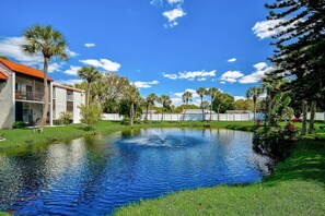 Surrounded by lush greenery and a tranquil pond, this serene setting invites relaxation and connection with nature.