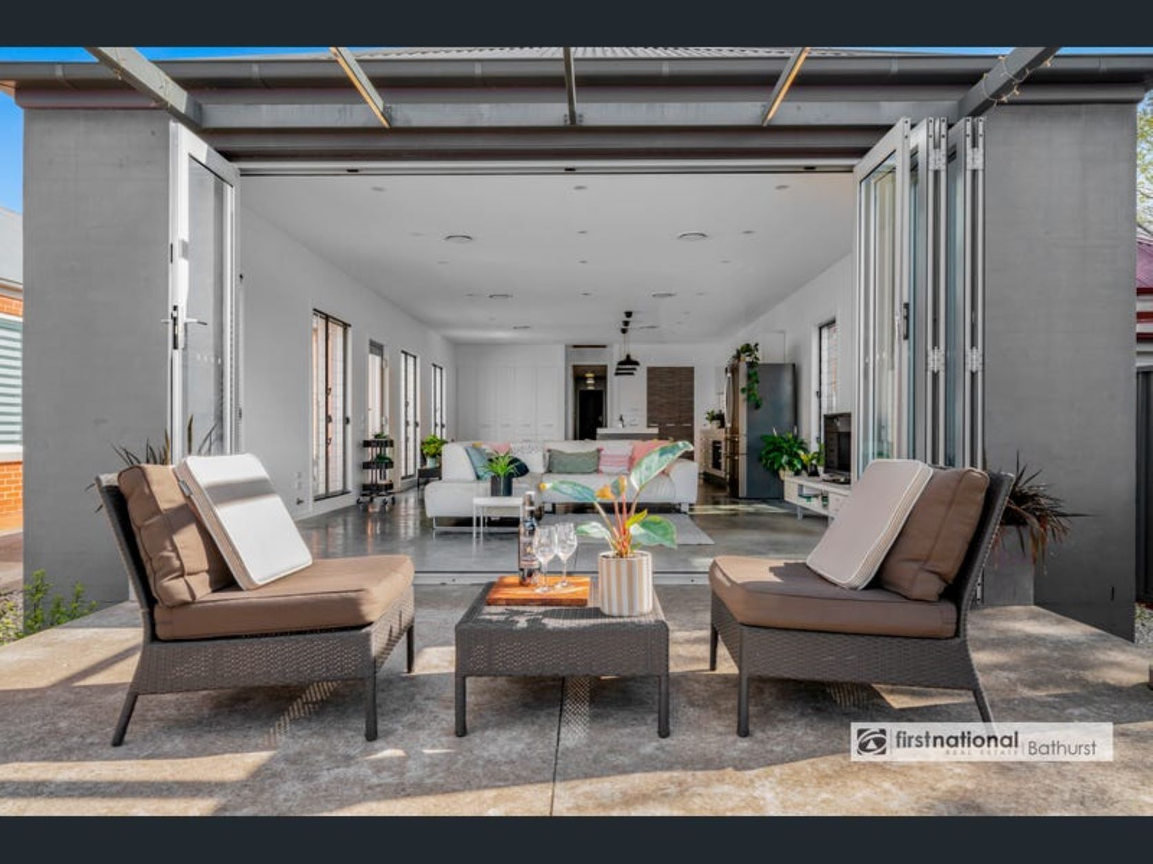 Looking into living from outdoor through opened concertina doors