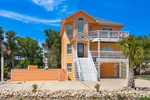 A two-story building with a balcony, a staircase, and a sign that reads "The Little House." - The Silly Geese: Pool Hot Tub Games, Walk to Beach (Corolla)