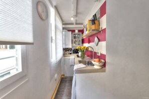 Fridge, microwave, stovetop, cookware/dishes/utensils