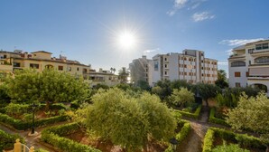 A residential area with a clear sky, sun shining, and well-maintained gardens. - Classic apartment  with communal pool in Javea, Costa Blanca, Spain for 4 persons (Javea)