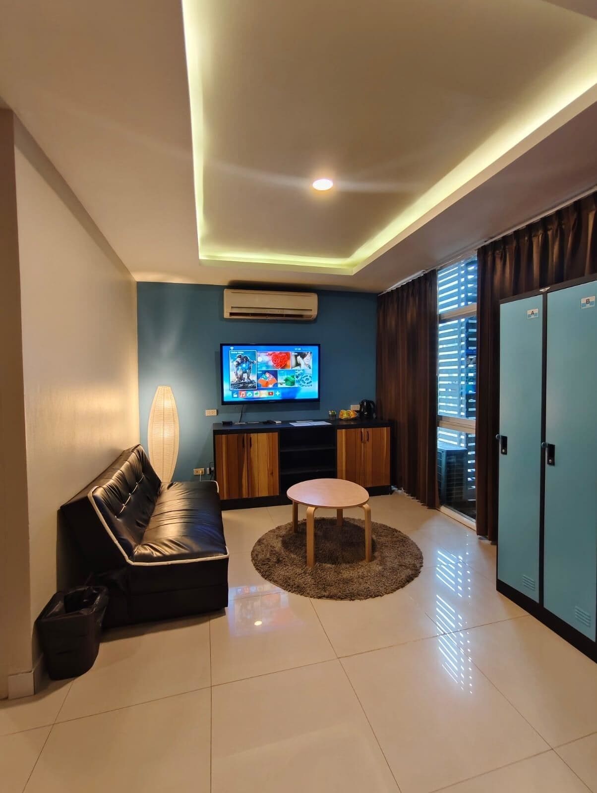 Quadruple Room | Living area | Flat-screen TV